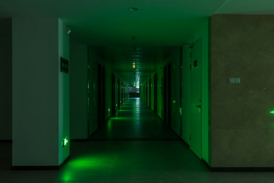 Communal corridor in a residential block with an emergency exit light