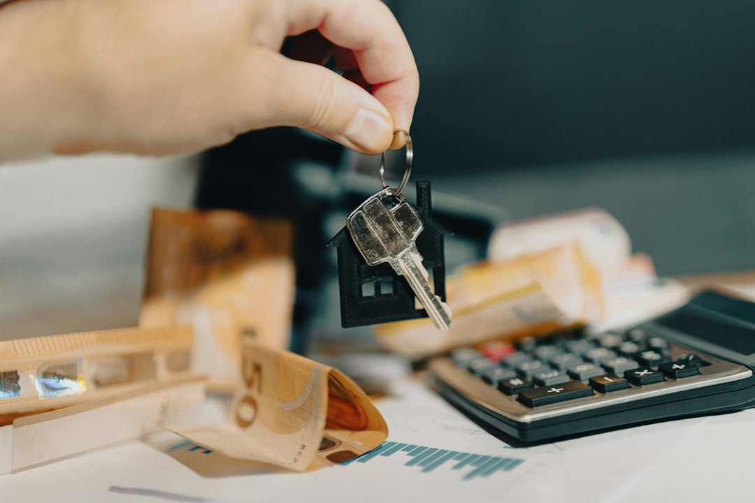 House key and calculator representing landlord certificate costs